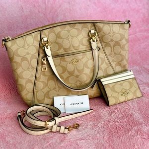 Coach satchel with strap and wallet.